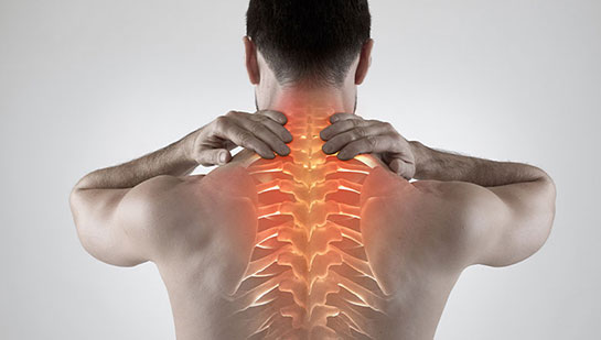 Man with upper back pain before chiropractic treatment from Louisville chiropractor